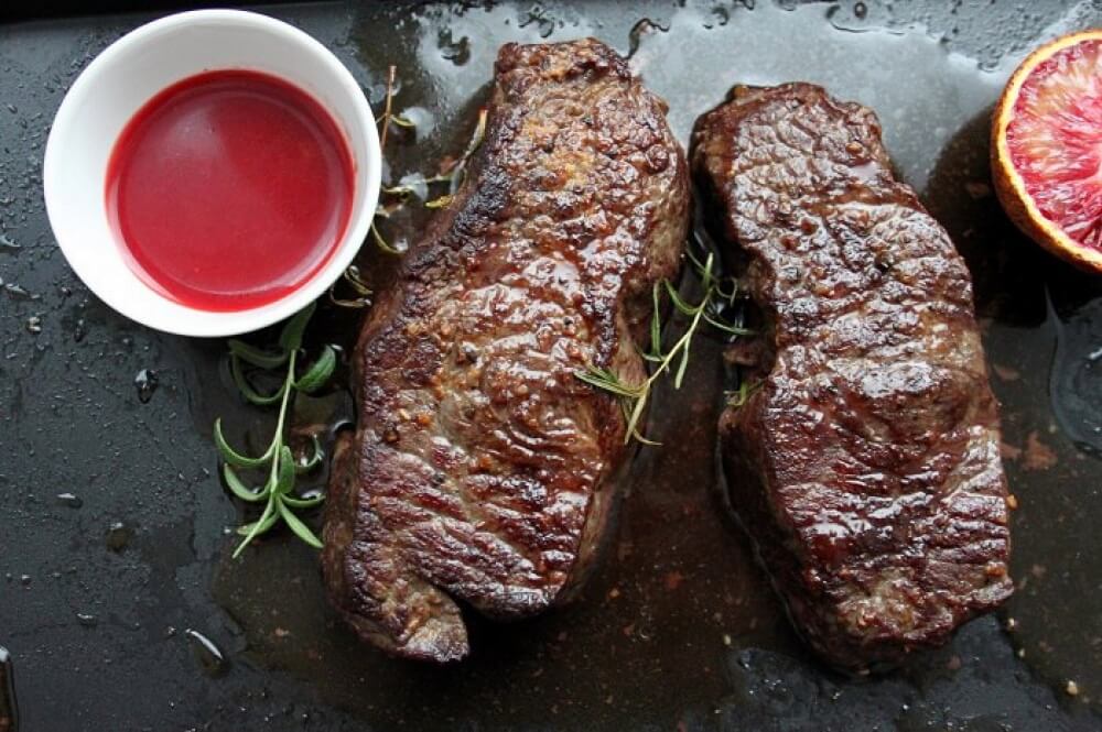 Beef steaks with citrus sauce