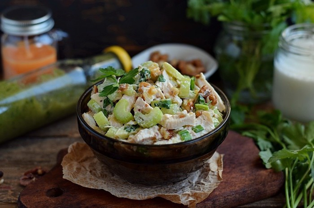 Salad with celery, chicken, apple and nuts