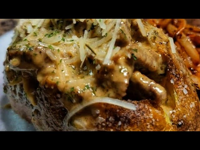 Steak Loaded Baked Potatoes with Alfredo Sauce