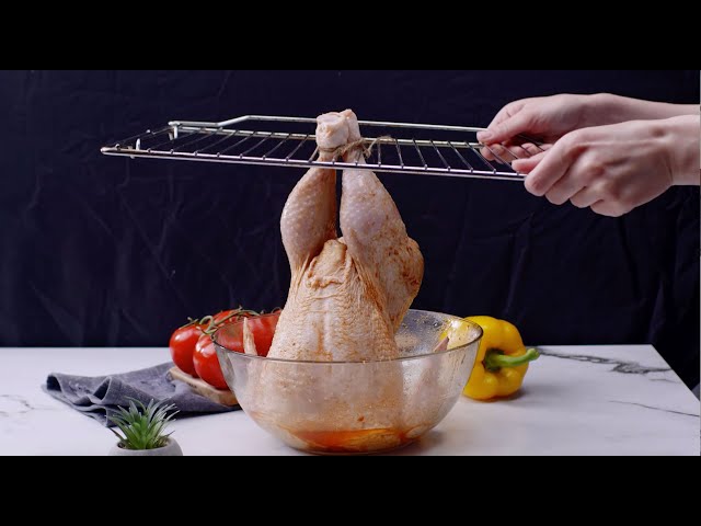 Hanged chicken in the oven