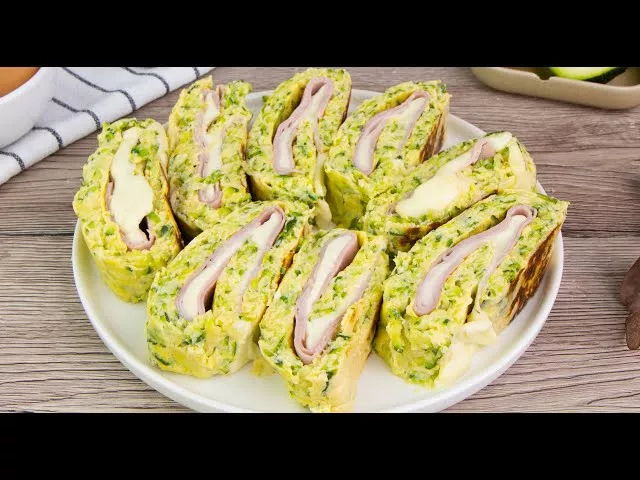 Egg zucchini roll with ham and cheese